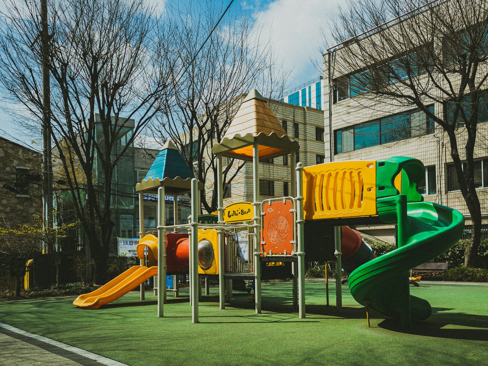 a children's play area in front of a building
